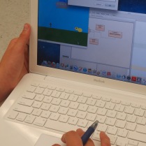 A student at Southeast High School shows his final project for a computer programming class